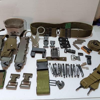 Large assortment of hooks and clips for military issued belts and tactical vests - knife sheaths - belt - canteen pieces.