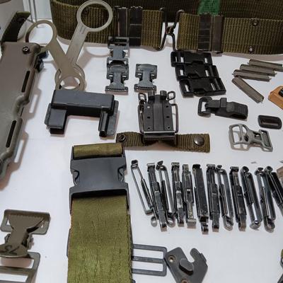 Large assortment of hooks and clips for military issued belts and tactical vests - knife sheaths - belt - canteen pieces.