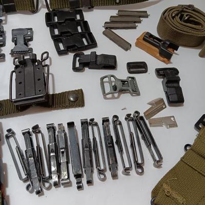 Large assortment of hooks and clips for military issued belts and tactical vests - knife sheaths - belt - canteen pieces.