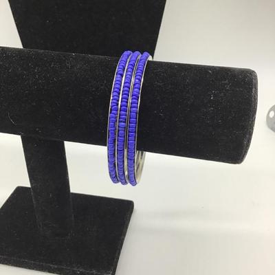Three blue beaded bracelets