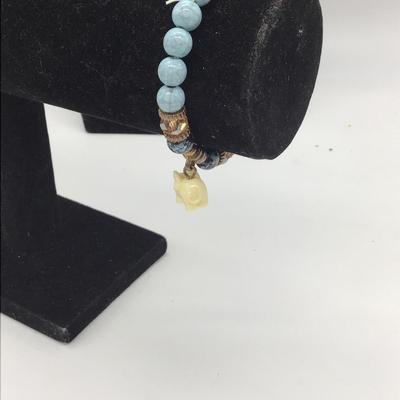 Blue beaded bracelet with elephant charm