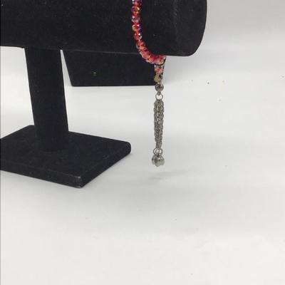 Red beaded bracelet with heart dangle charm