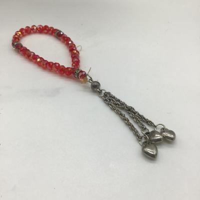 Red beaded bracelet with heart dangle charm