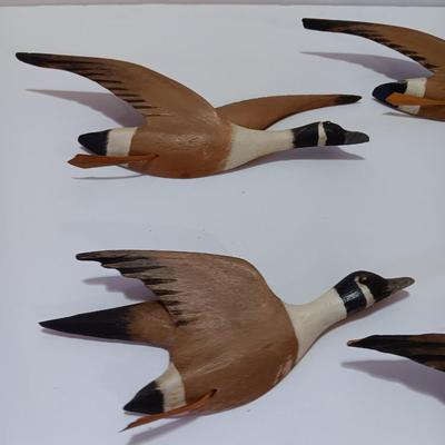 Wood carved Canadian geese wall hangings.
