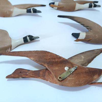 Wood carved Canadian geese wall hangings.