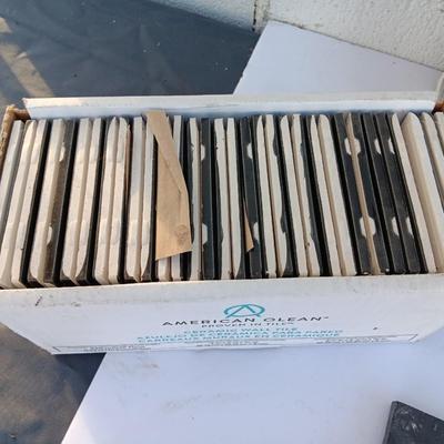 Boxes of black tile American Olean & Charcoal ledgestone
