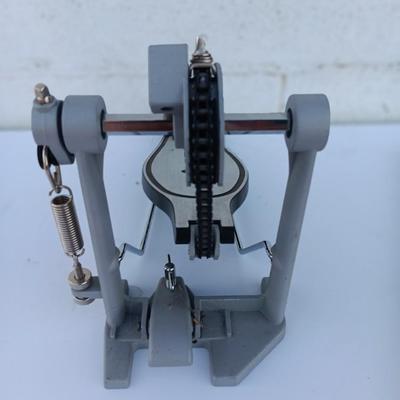 Alesis chain Kick Drum Pedal with a pair of drumsticks