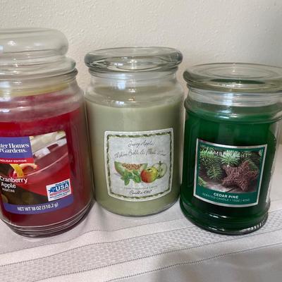 Large lot of candles in jars