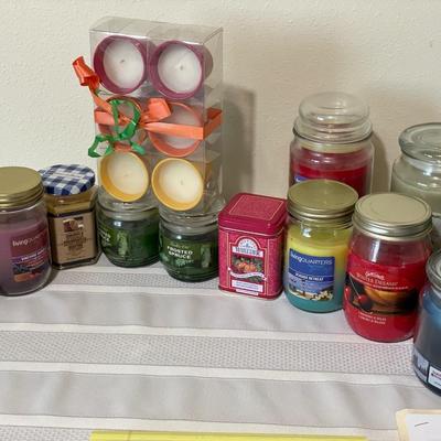 Large lot of candles in jars