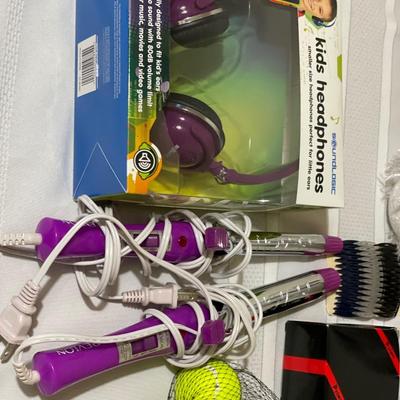 Kids items including headphones, curling irons and stuffed animals