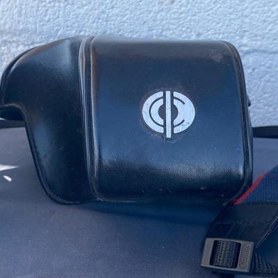 A Fun Polaroid sun600 Camera, with a EOS Canon Rebel E2 Camera