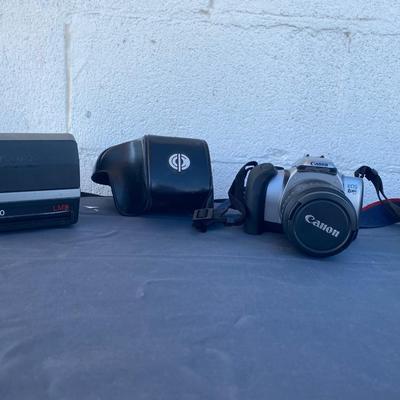 A Fun Polaroid sun600 Camera, with a EOS Canon Rebel E2 Camera