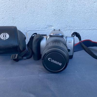 A Fun Polaroid sun600 Camera, with a EOS Canon Rebel E2 Camera