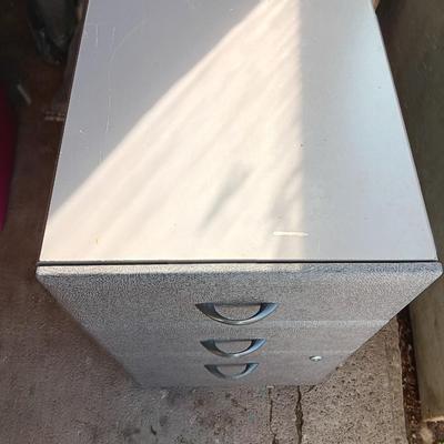 Three drawer filing cabinet on wheels