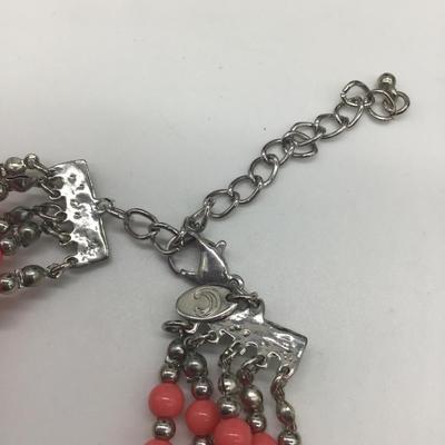 Bulky pink and peach colored necklace
