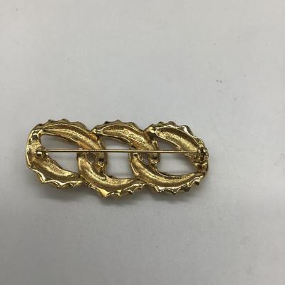 Gold toned design pin