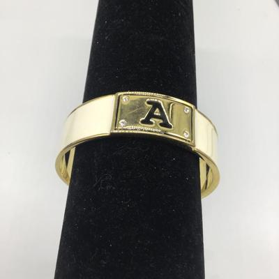 Gold toned and creme colored with letter A bracelet