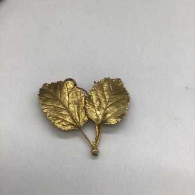 Gold toned leaf pin