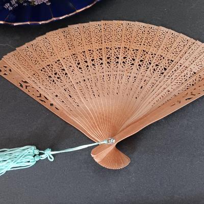 Blue vase with porcelain fan dish a wood varved fan and a vintage circle of friends pin cushion