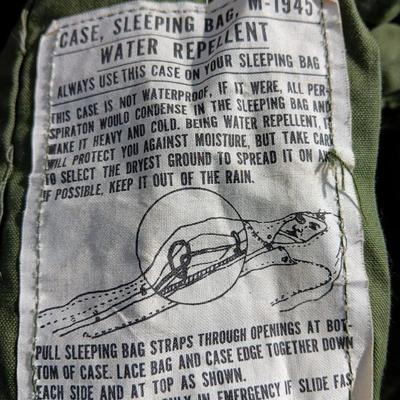 Military issued sleeping bag. - bed cushions - coveralls - and a waterproof military bag cover