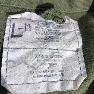 Military issued sleeping bag. - bed cushions - coveralls - and a waterproof military bag cover