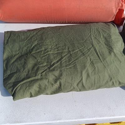 Military issued sleeping bag. - bed cushions - coveralls - and a waterproof military bag cover