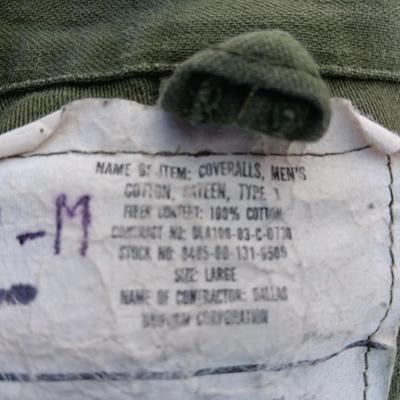 Military issued sleeping bag. - bed cushions - coveralls - and a waterproof military bag cover