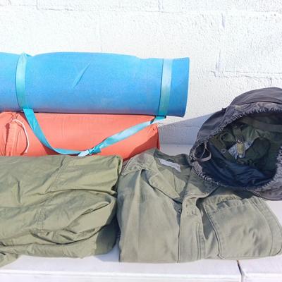 Military issued sleeping bag. - bed cushions - coveralls - and a waterproof military bag cover