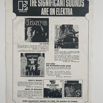 The Doors signed Elektra promotional record label poster autographed by Jim Morrison, Ray Manzarek, Robby Krieger, and John Densmore. 