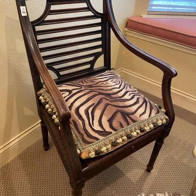 Beautiful arm chair with animal print pillow