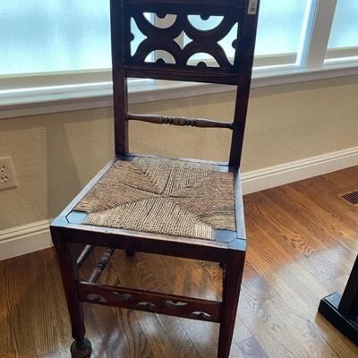 Antique chair with rope woven seat (wobbly)