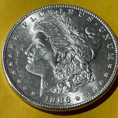 1886-P NICE BRILLIANT UNCIRCULATED MORGAN SILVER DOLLAR AS PICTURED.