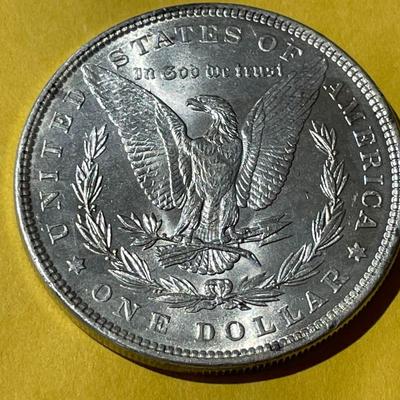 1889-P NICE UNCIRCULATED MORGAN SILVER DOLLAR AS PICTURED.