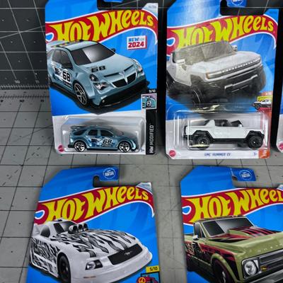 7 Hot Wheels NEW ON THE CARD