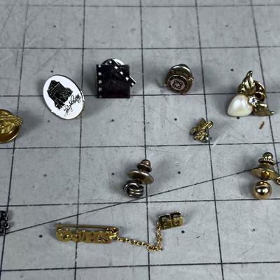 A Bunch of Pins and Tie Tacks 