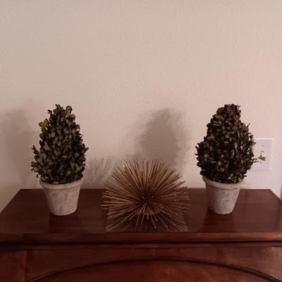 2 FAUX PLANTS IN CERAMIC POTS AND A GOLD STEEL SUNBURST