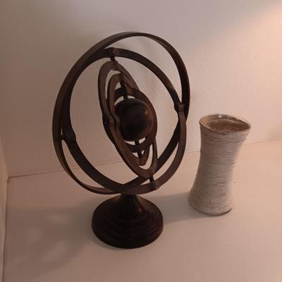 ROTATING METAL SPHERES AND A TWINE COVERED VASE