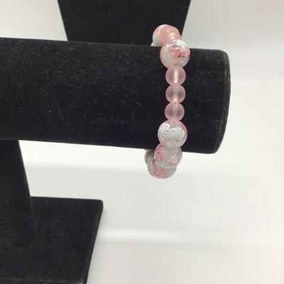 Gray,pink, and white designed bracelet