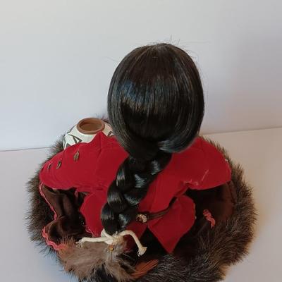 Porcelain Native American doll with small clay pot