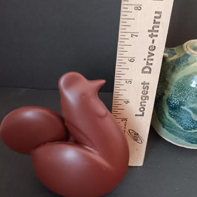 Three abstract chickens and a clay pottery picture
