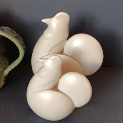 Three abstract chickens and a clay pottery picture