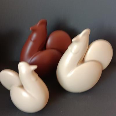 Three abstract chickens and a clay pottery picture