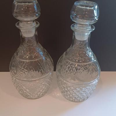 Two matching Princess House decanters with six green stemmed glasses