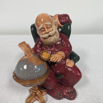 Santa Claus Looking Over World Globe Ceramic