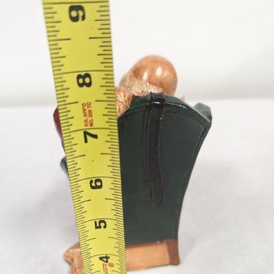 Santa Claus Looking Over World Globe Ceramic