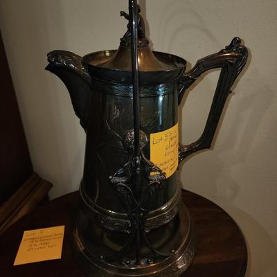 Silver plated tipping water pitcher