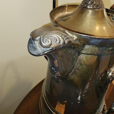 Silver plated tipping water pitcher