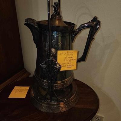 Silver plated tipping water pitcher