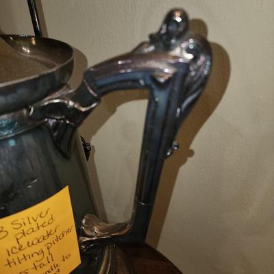 Silver plated tipping water pitcher