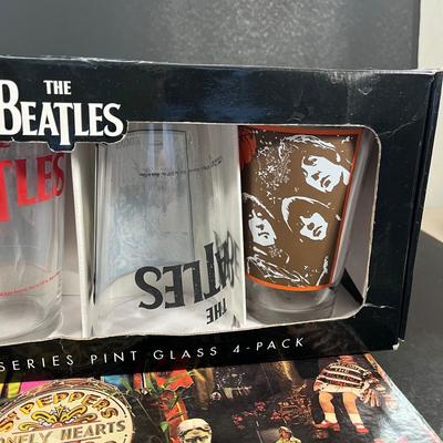 LOT 143: The Beatles Vintage Vinyl Record Albums and Collectible Pint Glass Set